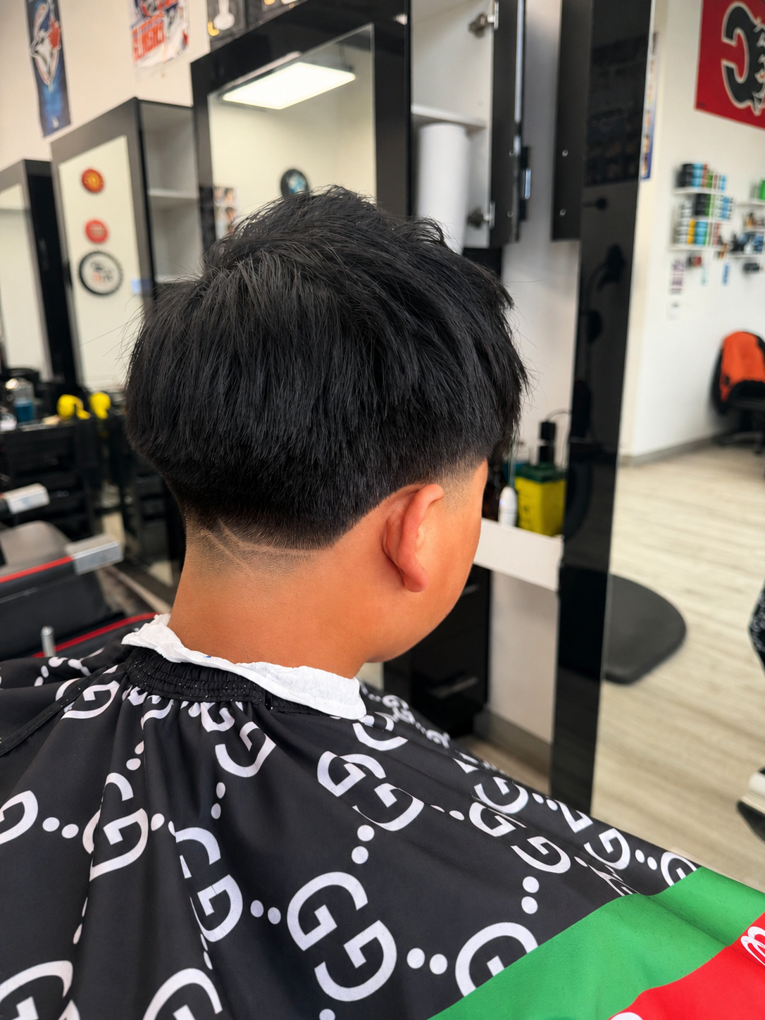 After taper cut with design at Legacy Barbershop Calgary
